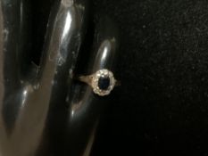 A 9CT HALLMARKED GOLD DIAMOND AND SAPPHIRE DRESS RING; SIZE J; 2.5 GMS.
