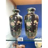 A PAIR OF ORIENTAL CLOISONNE VASES DECORATED WITH FLOWERS; 23 CMS.