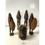 FOUR AFRICAN CARVED WOODEN FIGURES OF WARRIOR MEN AND WOMEN; 30 CMS AND CARVED BUST.