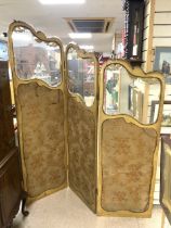 A FRENCH GLAZED GILTWOOD AND EMBROIDERED PANEL THREE FOLD SCREEN.