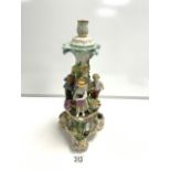 CONTINENTAL FLORAL ENCRUSTED PORCELAIN CANDLESTICK WITH FLOWER PICKERS IN ATTENDANCE; 42 CMS.
