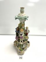 CONTINENTAL FLORAL ENCRUSTED PORCELAIN CANDLESTICK WITH FLOWER PICKERS IN ATTENDANCE; 42 CMS.