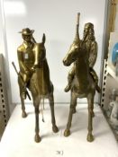 TWO LARGE BRASS FIGURES OF COWBOY AND FIRST GENERATION; 64 CMS.