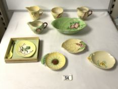 A SELECTION OF CARLTON WARE DISHES AND THREE MILK JUGS.