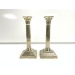 PAIR OF VICTORIAN HALLMARKED SILVER CORINTHIAN COLUMN CANDLESTICKS WITH STEPPED BASES; SHEFFIELD