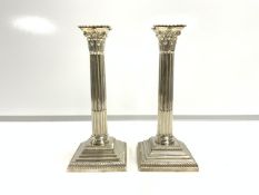 PAIR OF VICTORIAN HALLMARKED SILVER CORINTHIAN COLUMN CANDLESTICKS WITH STEPPED BASES; SHEFFIELD