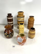 SEVEN 1960s WEST GERMAN POTTERY VASES; TALLEST 30 CMS.