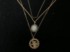 TWO 375 HALLMARKED GOLD PENDANTS ON CHAINS AND A FINE UNMARKED CHAIN; 5 GRAMS.