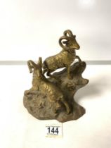 A BRASS FIGURE OF TWO MOUNTAIN GOATS; 20 CMS.