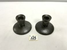 A PAIR OF TUDRIC PEWTER SQUAT CANDLESTICKS; 8CMS.
