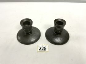 A PAIR OF TUDRIC PEWTER SQUAT CANDLESTICKS; 8CMS.