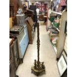 FRENCH ORNATE CORINTHIUM COLUMN ORMULO AND BRASS LAMP STAND WITH CHERUB SUPPORTS TO BASE.