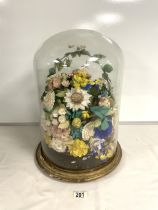 A VICTORIAN GLASS DOME; CIRCA 1870; CONTAINING A DISPLAY OF SHELL FORM FLOWERS; ON A GILTWOOD