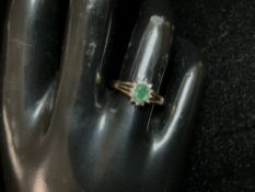 A 9CT HALLMARKED GOLD RING; SET WITH SMALL DIAMONDS AND EMERALD; SIZE O; 1.6 GMS.