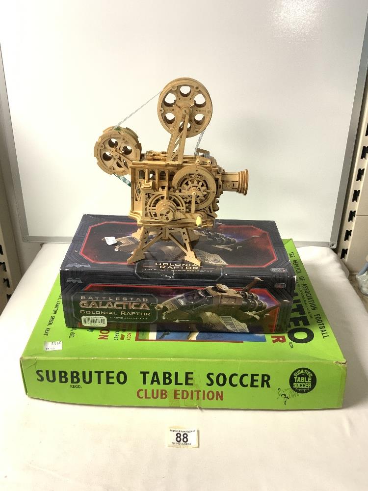 A MINATURE WOODEN MODEL OF A FILM PROJECTOR BY ROKR, SUBBUTEO TABLE SOCCER GAME AND A BATTLE STAR