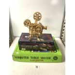 A MINATURE WOODEN MODEL OF A FILM PROJECTOR BY ROKR, SUBBUTEO TABLE SOCCER GAME AND A BATTLE STAR