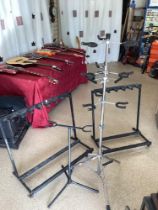 GUITAR STANDS HOLDS 7 AND 5 GUITARS WITH A CHROME ADJUSTABLE GUITAR STAND HOLDING 9 GUITARS