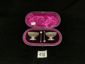 A PAIR OF VICTORIAN HALLMARKED SILVER ENGRAVED FLUTED SALTS AND MATCHING SPOONS; LONDON 1892; ROBERT