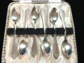 A SET OF SIX DANISH MARKED SILVER TEA SPOONS; MAKER A.T (CASED).