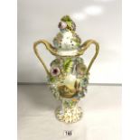 A COALPORT DESIGN PORCELAIN AND FLORAL ENCRUSTED SNAKE HANDLE VASE WITH HAND-PAINTED PANEL; 43 CM.