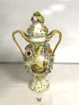 A COALPORT DESIGN PORCELAIN AND FLORAL ENCRUSTED SNAKE HANDLE VASE WITH HAND-PAINTED PANEL; 43 CM.
