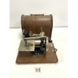 A SMALL VINTAGE HAND SEWING MACHINE ' FEDERATION ' IN OAK CASE.