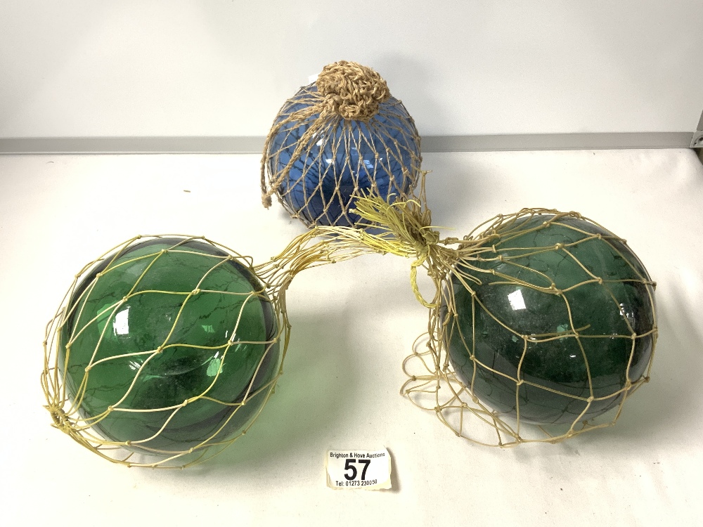 THREE VINTAGE GREEN GLASS FISHING FLOATS.