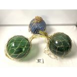 THREE VINTAGE GREEN GLASS FISHING FLOATS.