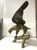 A CAST BRASS MODEL OF EAGLE ON BRANCH; 48X60 CMS APPROX.