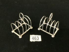 PAIR OF HALLMARKED SILVER FOUR DIVISION TOAST RACKS ON BALL FEET; BIRMINGHAM 1933; S BLACKENSEE &