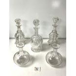 A HEAVY CUT GLASS DECANTER, PAIR OF ETCHED SHERRY DECANTERS AND TWO OTHER DECANTERS.