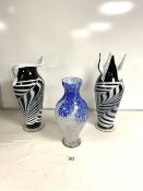 TWO STUDIO GLASSWARE BLACK AND WHITE VASES; 42 CMS AND A SIMILAR BLUE AND WHITE VASE.