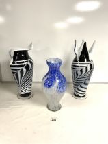 TWO STUDIO GLASSWARE BLACK AND WHITE VASES; 42 CMS AND A SIMILAR BLUE AND WHITE VASE.