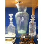 TALL GLASS VASE; 36 CMS AND TWO GLASS DECANTERS.