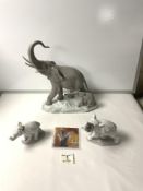 LLADRO MOTHER ELEPHANT AND CALF GROUP; 30 CM AND TWO LLADRO ELEPHANTS WITH FLORAL DECORATION.