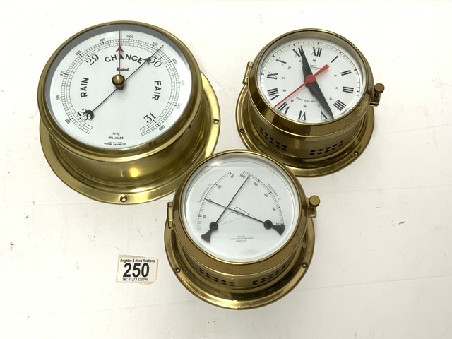 A BRASS MARINE BAROMETER BY SESTREL AND A MARINE BRASS THERMOMETER / HYDROMETER.