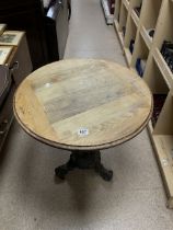 CIRCULAR OAK PUB TABLE WITH CAST IRON SEA SERPENT SUPPORT BASE; 66CMS DIAMETER.