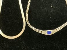 A 925 SILVER GREEK KEY PATTERN NECKLACE SET WITH BLUE STONE AND A 925 SILVER NECKLACE.