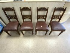 A SET OF FOUR LATE VICTORIAN CARVED OAK DINING CHAIRS.