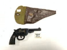 VINTAGE TIN PLATE TOY PISTOL WITH LEATHER HOLSTER