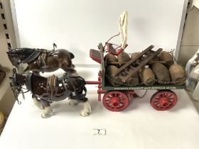 A WATNEYS DRAUGHT AND BOTTLE BEERS WOODEN BARREL CART WITH TWO PORCELAIN SHIRE HORSE; 60X20 CMS.