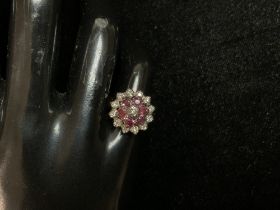 A 9CT HALLMARKED GOLD DIAMOND AND RUBY SET FLOWER HEAD DRESS RING; SIZE K 1/2; 5.5 GMS.