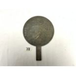 A CHINESE BRONZE HAND MIRROR WITH RELIEF DECORATION; 32 CMS.