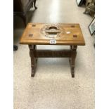 A CARVED GOTHIC OAK STOOL.