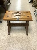 A CARVED GOTHIC OAK STOOL.