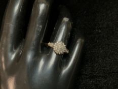 A 9CT HALLMARKED GOLD AND SMALL CLUSTER DIAMOND RING; SIZE O & 1/2; 2.5 GMS.