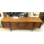 A MID-CENTURY TEAK SIDEBOARD WITH FOUR DOORS AND FOUR CUPBOARDS; 214X46X80 CM.