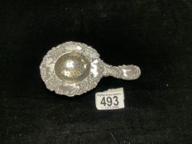CONTINENTAL SILVER EMBOSSED CIRCULAR TEA STRAINER; HAS ENGLISH IMPORT MARK; 15 CM;, 67 GMS.