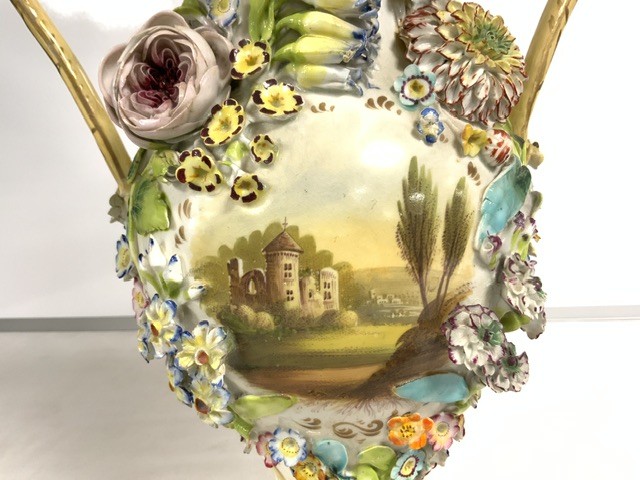 A COALPORT DESIGN PORCELAIN AND FLORAL ENCRUSTED SNAKE HANDLE VASE WITH HAND-PAINTED PANEL; 43 CM. - Image 2 of 6