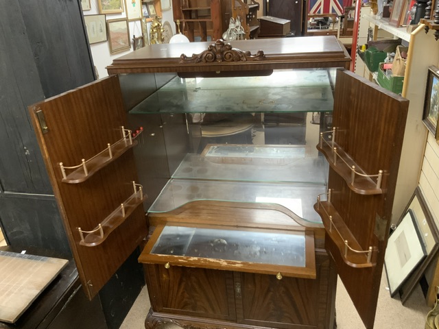 A FLAME MAHOGANY COCKTAIL CABINET FITTED WITH GLASS SHELVES AND COCKTAIL STICKS; 90X168X40 CMS. - Image 2 of 3